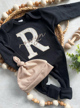 Load image into Gallery viewer, Personalized neutral baby romper and hat set, custom infant boy coming home outfit, baby shower gift, black sleeper with footies