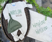 Load image into Gallery viewer, Baby outfit with onesie, hat, and blanket featuring &#39;Waylon Walker&#39; on a wooden surface with greenery.
