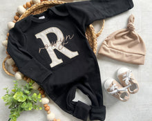 Load image into Gallery viewer, Personalized neutral baby romper and hat set, custom infant boy coming home outfit, baby shower gift, black sleeper with footies
