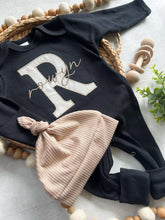 Load image into Gallery viewer, Personalized neutral baby romper and hat set, custom infant boy coming home outfit, baby shower gift, black sleeper with footies
